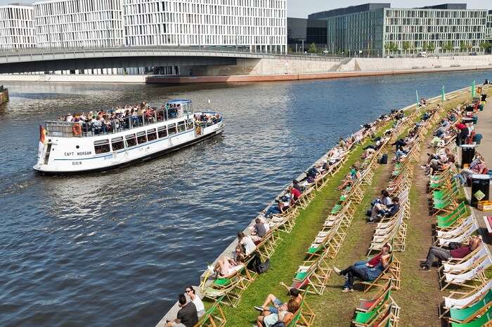 people sitting by beach in berlin