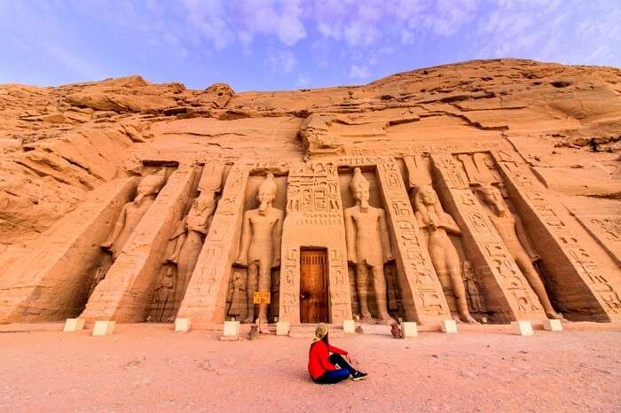 Girl sitting in front of Abu Simbel temples