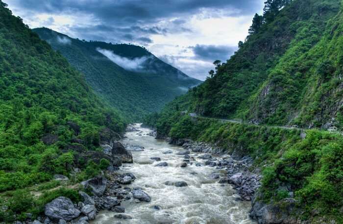 A wonderful view of Almora packed with lush greenery, pristine water and misty hills