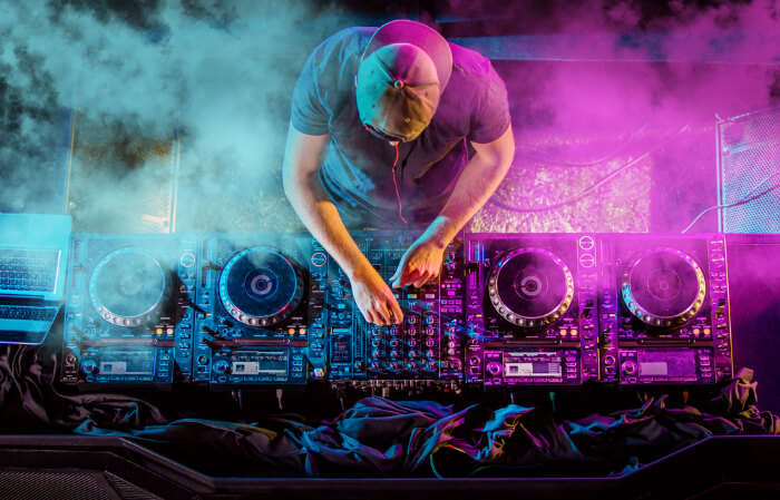 A DJ artist at his music console