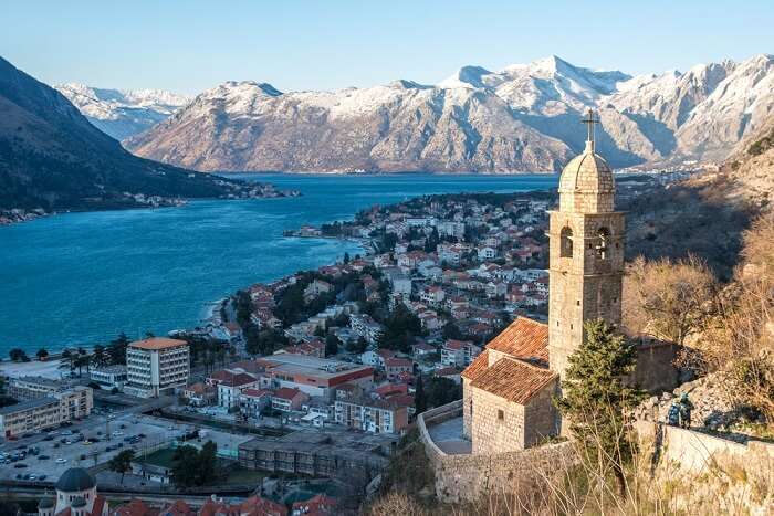 snow capped mountains and city in Montenegro