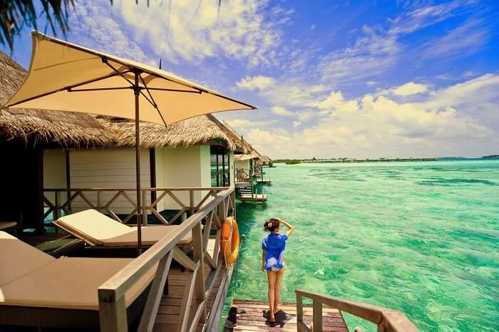 female traveler in maldives looking at the sea