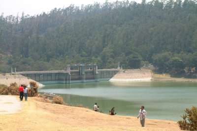 People standing near the dam