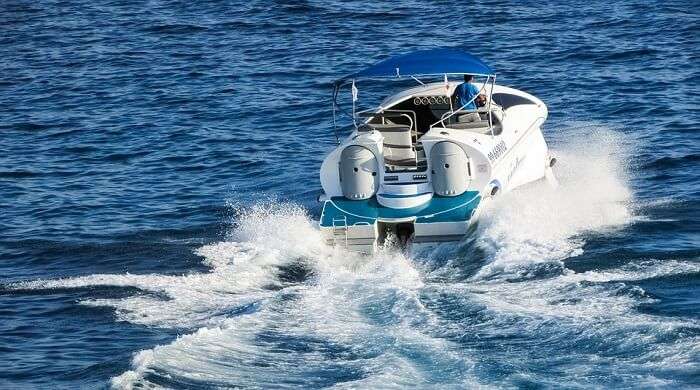 person riding a speed boat