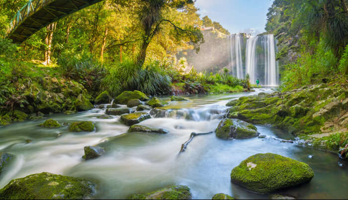 waterfall valley new zealand steep torrent group mountain blue