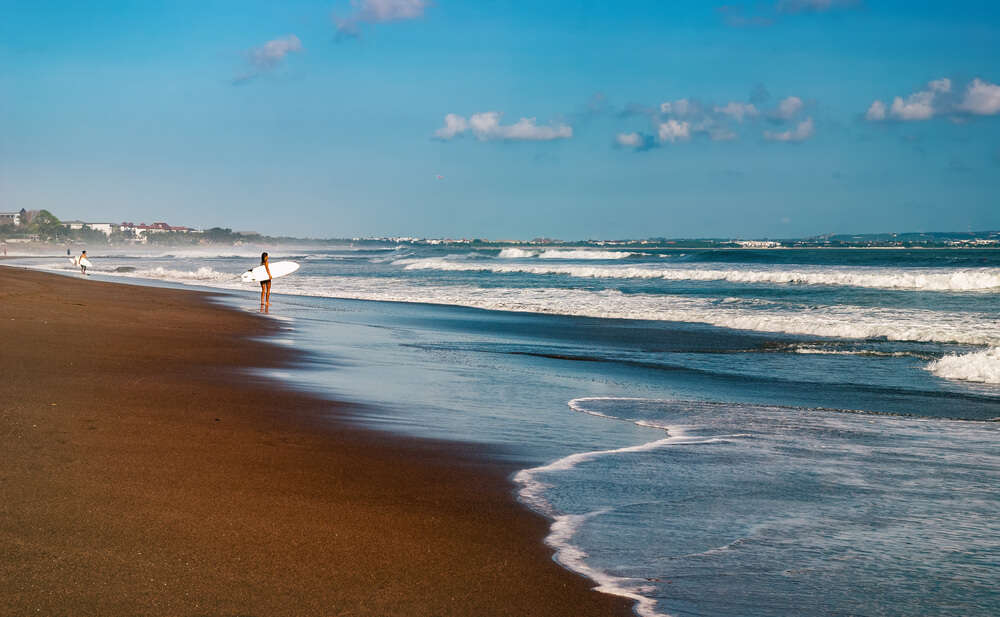 A girl surfing in beach