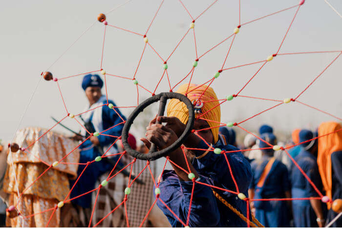 A man performing Punjabi folk dance