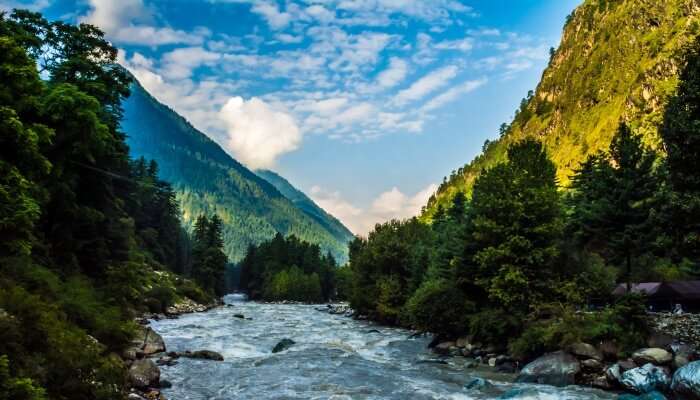 River flowing between lush-green mountains