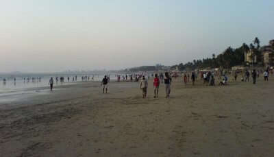 Enjoy a stroll at Juhu Beach, one of the most relaxing places to visit in Mumbai in summer