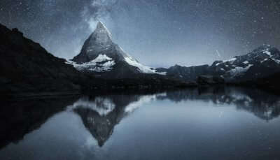 Matterhorn and reflection on the water surface at the night time