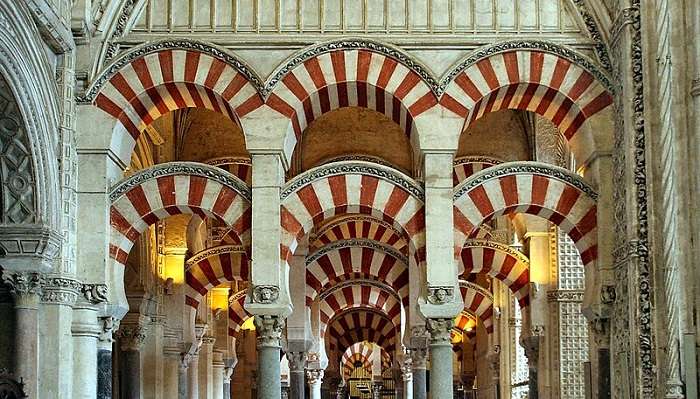 A flowery courtyard in the Cordoba and mosque to explore in the Spain