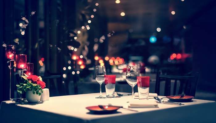 romantic dinner setup with candle light in a restaurant