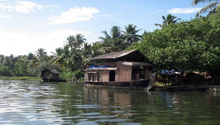 Houseboats on a lake near Karunagappally, one of the best places to visit in Kollam.