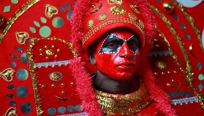 Watch Theyyam, one of the best things to do in Kerala