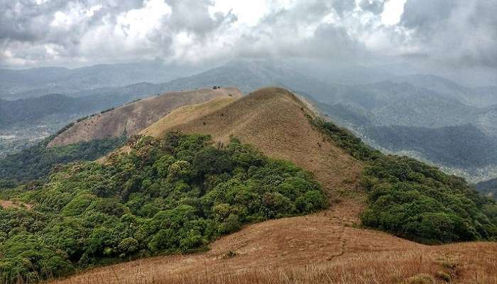 One of the best places to visit in Coorg in July for trekking and camping.