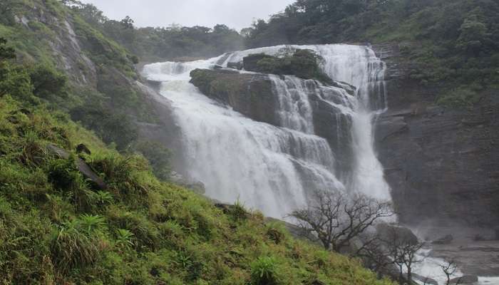A powerful waterfall, Mallalli Falls iis one of the best places to visit in Coorg in July on a Karnataka tour.