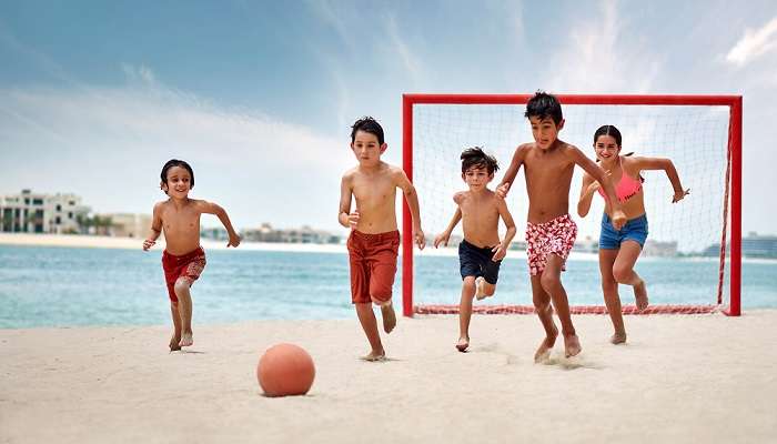 Palm Beach Kids Playing Soccer, one of the things to do at Atlantis in Dubai