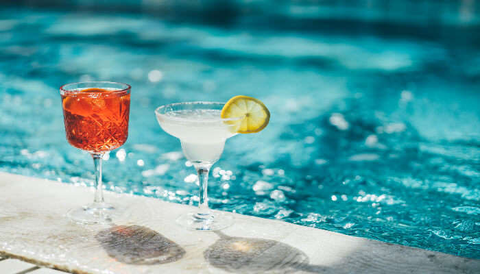 Enjoy refreshing cocktails near swimming pool