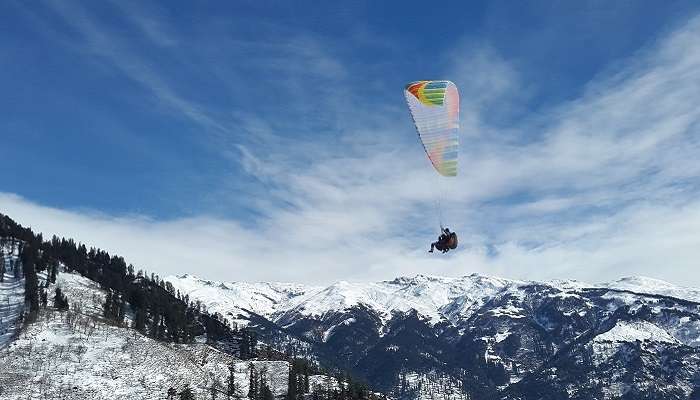 Choose Solang Valley for indulging in adventure activities like paragliding. 