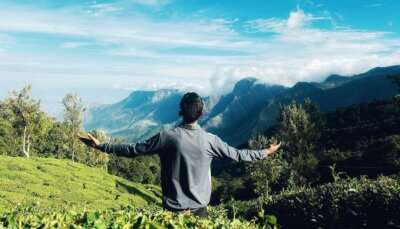Someone enjoying the cool weather and scenic beauty of Kerala in December.