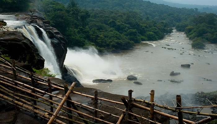 The Athirapalli Falls is a majestic and powerful waterfall, one of the best places to visit in August in India.