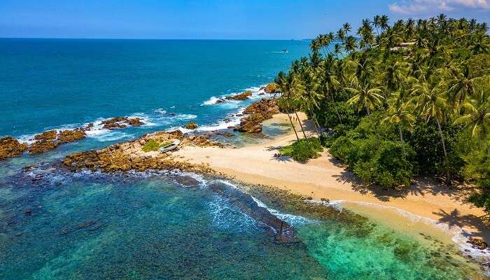 A majestic aeriel view of secret beach in Mirissa