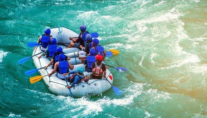 tourist enjoying white water rafting at one of the best places to visit in India