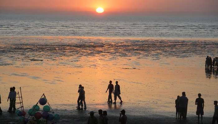 Tithal Beach is one of the places to visit in Valsad to watch the sunset and black sand.