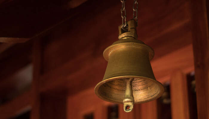 View of a traditional copper bell in Sri Veereswara Swamy Temple, one of the top tourist places to visit in Yanam
