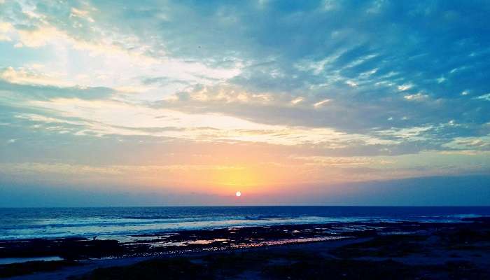 Witness a spectacular sunset at Veraval beach while exploring the best places to visit in Veraval