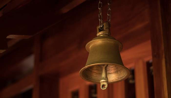 A view of the temple bell in Chakkulathu Kavu Temple, one of the tourist places near Thiruvalla