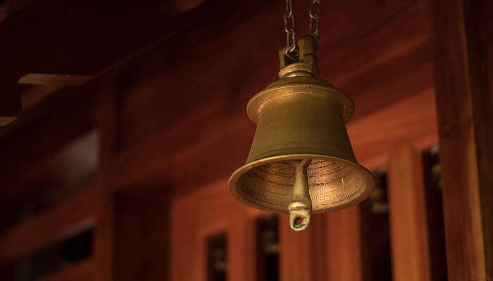 A temple bell at Sri Anjaneya Swamy Temple, one of the religious places worth visiting in Kanakapura