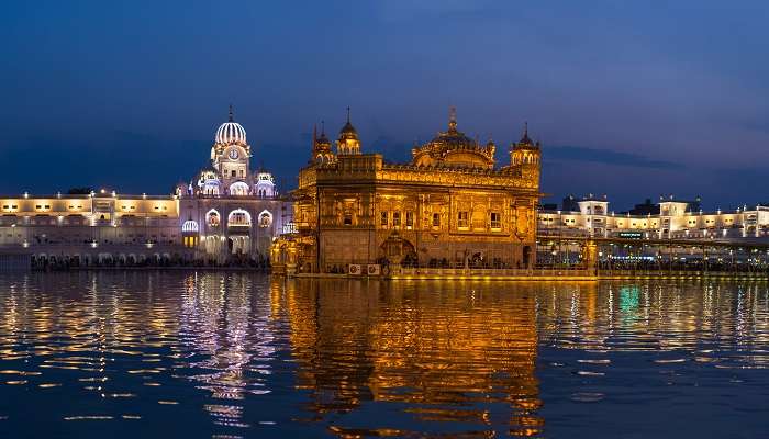 Night view of the Golden Temple that is reflected on the lake.