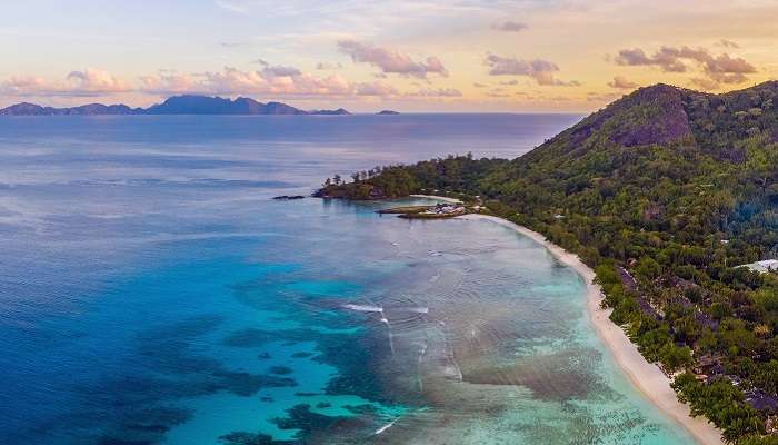  The aerial sunset view of Silhouette Island, wherein one of the best resorts in Seychelles, Hilton Labriz Resort & Spa is located. 