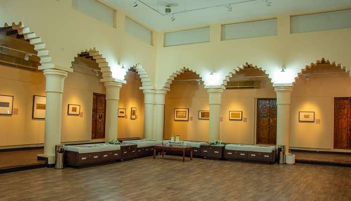 The inside of Sharjah Calligraphy Museum, with a traditional sitting area; one of the most interesting museums in Sharjah.