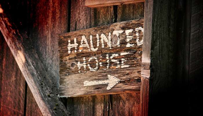 A signboard of Haunted House, one of the thrilling amusement parks in Denver