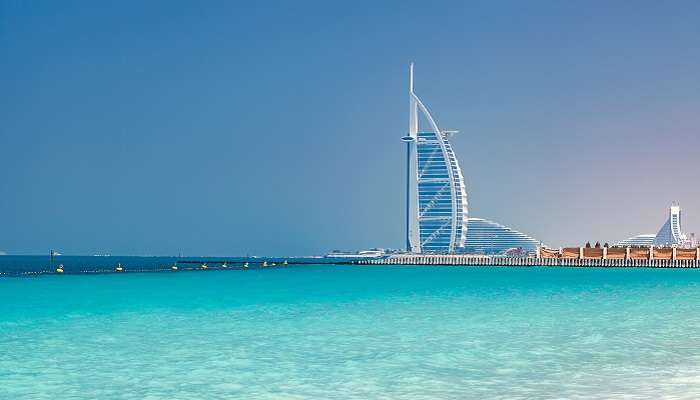 The scene of one of the private beaches in Dubai, Al Sufouh Beach, in sea Persian Gulf and Burj Al Arab, from Jumeirah Beach Hotel. 