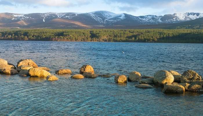 The scene of Loch Morlich in the Badenoch and Strathspey area of Highland, located near Aviemore, one of the smallest towns in Scotland