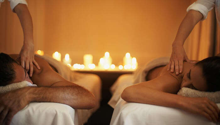 A romantic view of couples getting massage sessions together 