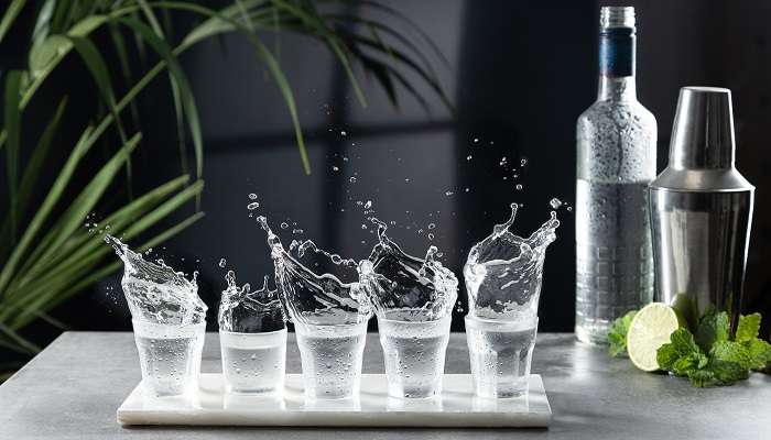 A generic image of Vodka shots splash at a bar