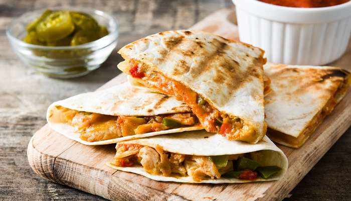 Mexican quesadilla filled with chicken, cheese, and peppers at one of the top Mexican restaurants in Abu Dhabi, Dusk. 