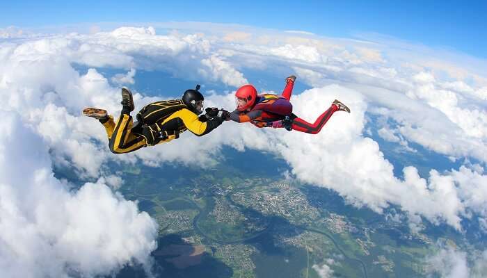 A thrilling view of couples doing skydiving together