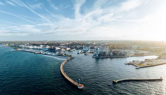 The panoramic view of one of the best small towns in southern Sweden, Helsingborg, through the breakwaters. 