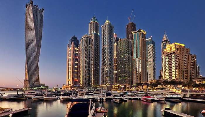 A skyline panoramic view of Dubai Marina with Infinity Tower, one of Dubai iconic buildings. 