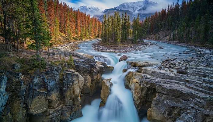 A scenic view of Sunwapta Falls located at Jasper National Park in Jasper, one of the small towns in Alberta