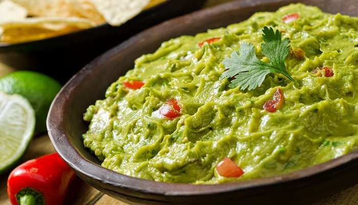 The mouth-watering Guacamole with tortilla chips, the best Mexican food in Abu Dhabi.