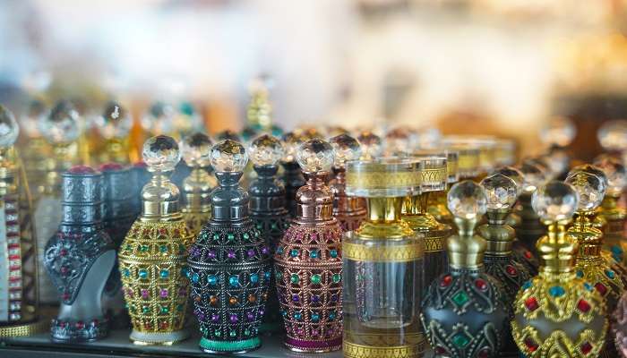 A variety of perfumes are on display at the Deira Perfume Souk, with many different fragrances, shapes, and colours.