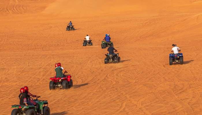 An amazing view of people having fun with a quad bike ride in Dubai