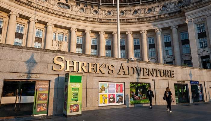 An outer view of Shrek’s Adventure that is located in the Country Hall building