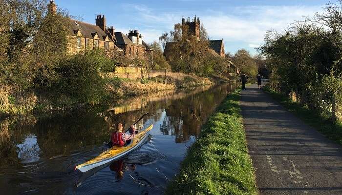The view of a kayaker on the Union Canal, one of the hidden gems in Scotland